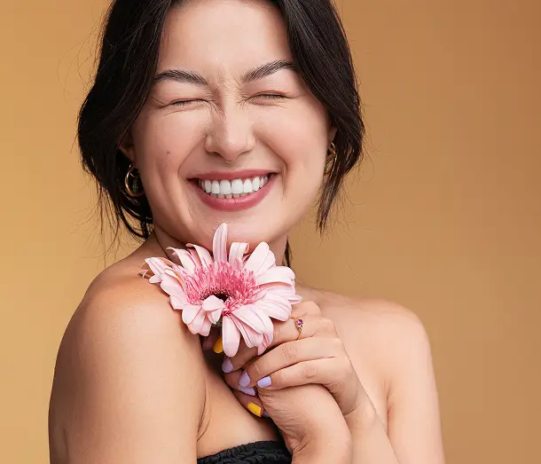 happy middle aged woman with beautiful skin smiling